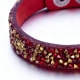 Armband mit roten und goldenen Swarovski Elements und rotem Lederband